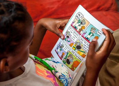 Boy reading a comic