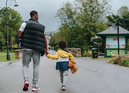 father & son walking