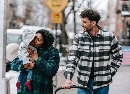 parents and baby outside
