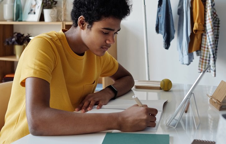 Teenager writing