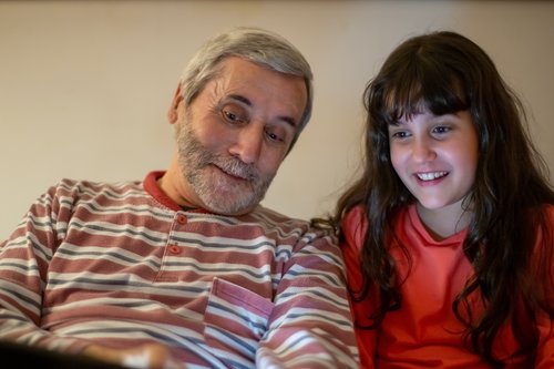 Grandparent and child talking