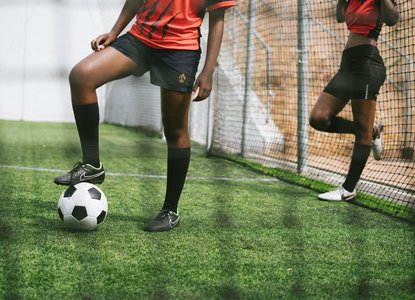 Girls playing football
