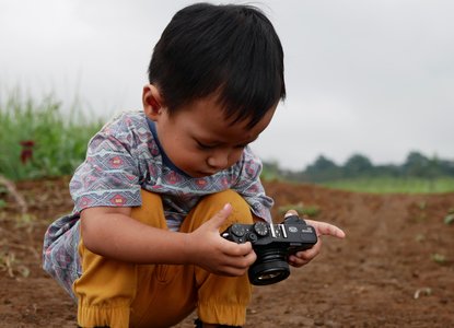 child with camera