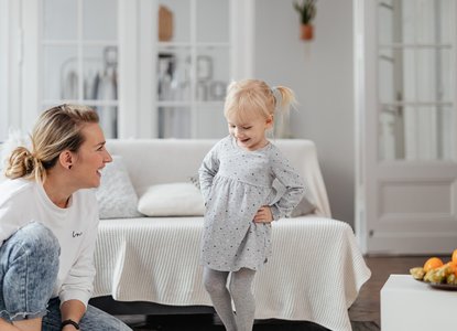mother and daughter laughing